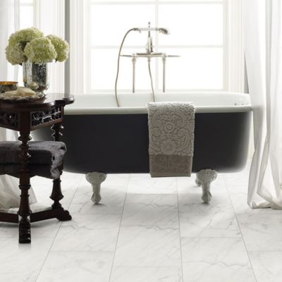 tile flooring in an elegant bathroom with  tub